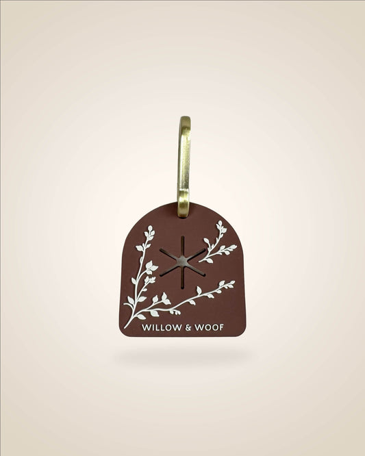 Brown dog waste/poop bag carrier, white botanical flowers with bronze tone hardware