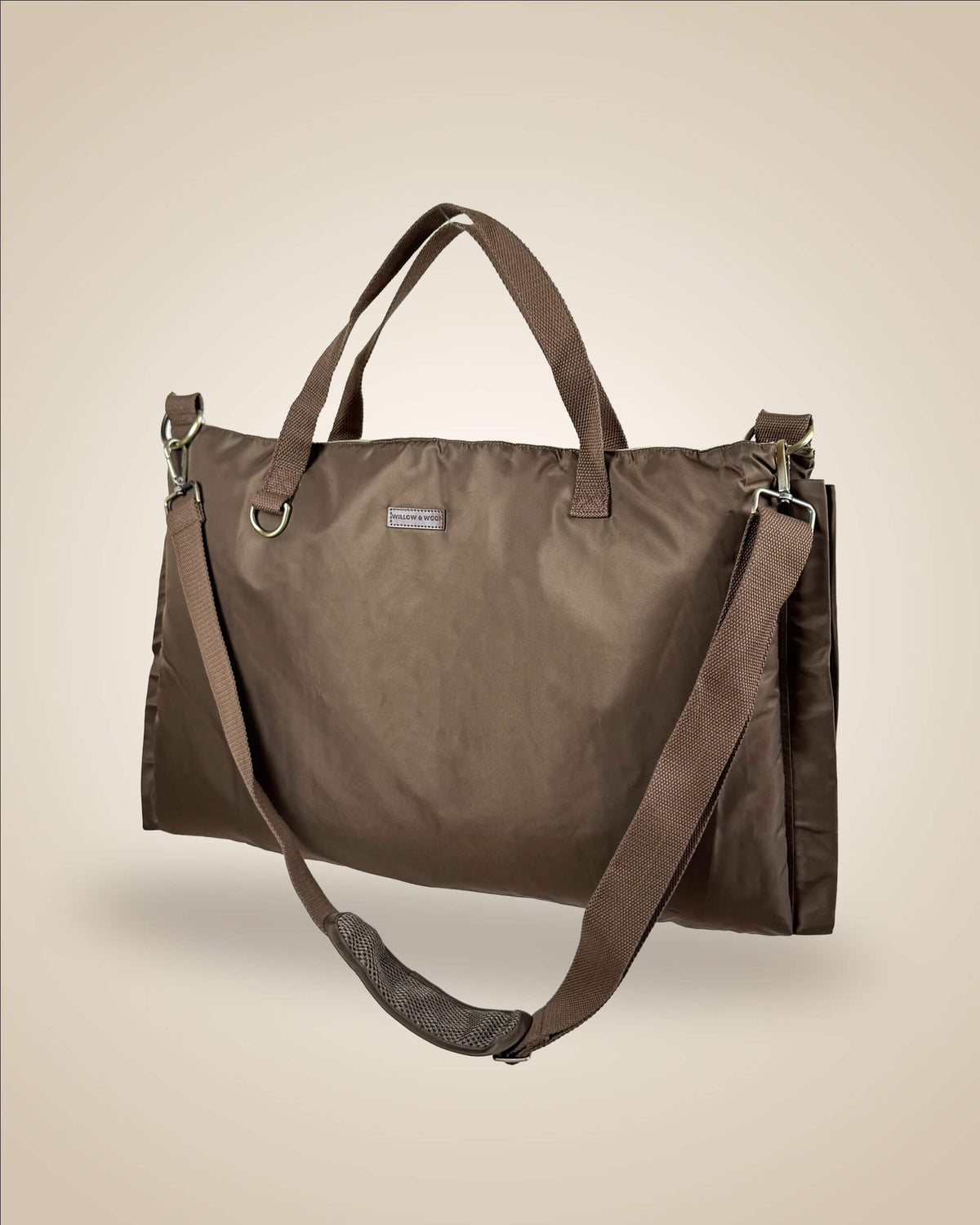 A brown dog settle mat tote bag with dual top handles and a detachable adjustable shoulder strap, water-proof