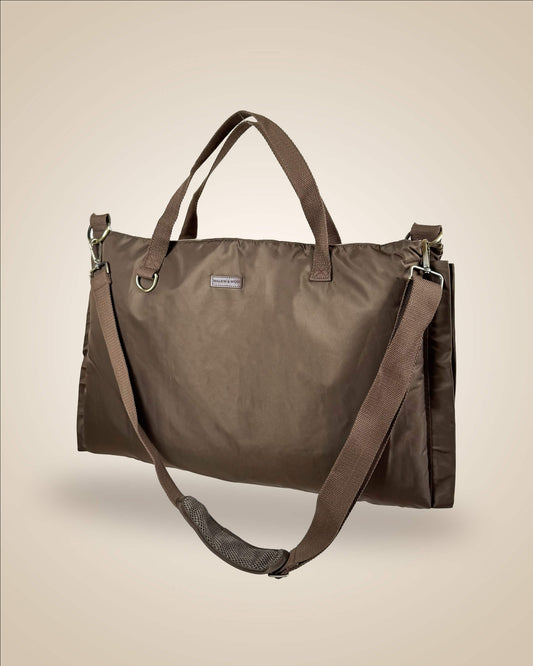 A brown dog settle mat tote bag with dual top handles and a detachable adjustable shoulder strap, water-proof